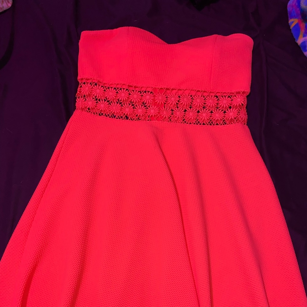 bright orange/pink colored strapless dress